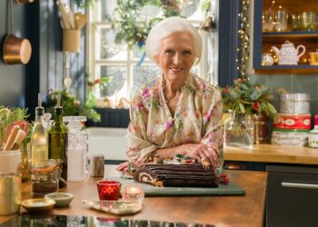 Mary Berry stands in a festively decorated kitchen