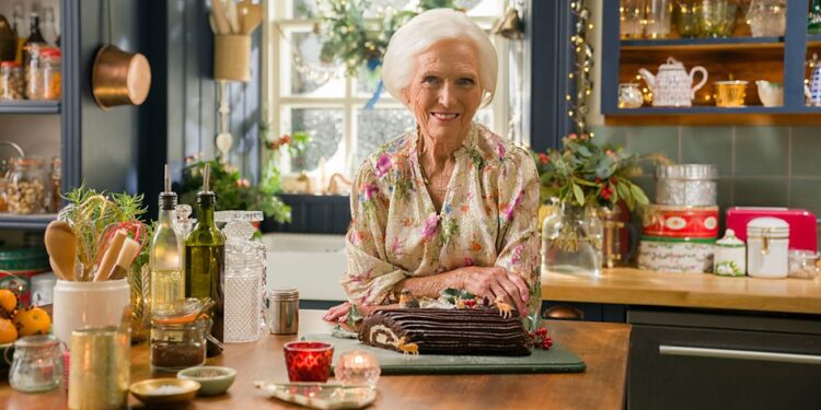 Mary Berry stands in a festively decorated kitchen