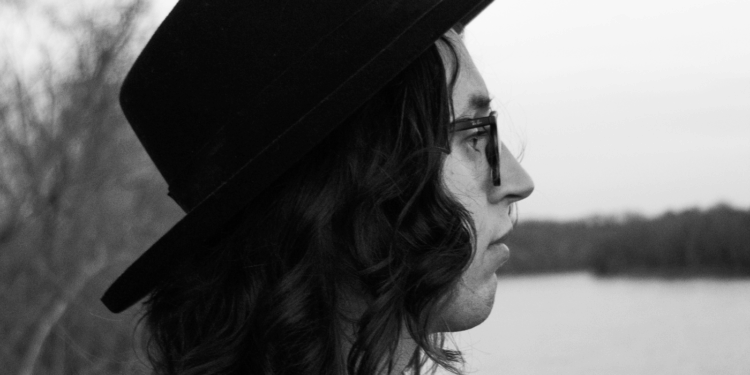 Black and white album cover of a solo man in a hat who is singer Gabe Parsons
