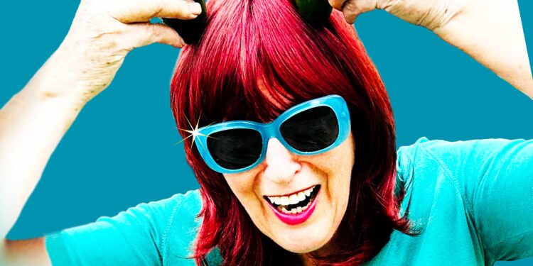 Promotional image of Janet Street Porter in a blue t shirt on a blue background